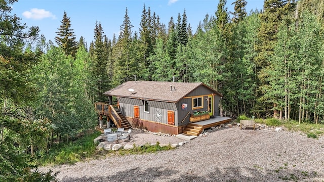 932 Peterson Dr, Alma, CO 80420 - view of front of house featuring a deck, stairs, a view of trees, and driveway