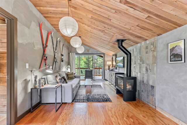 932 Peterson Dr, Alma, CO 80420 - living area with wooden ceiling, wood finished floors, lofted ceiling, and a wood stove