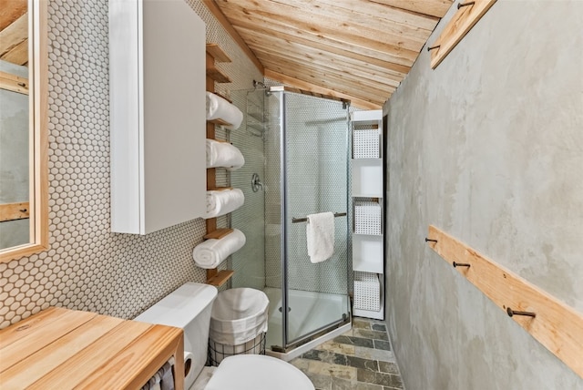 932 Peterson Dr, Alma, CO 80420 - bathroom featuring stone tile flooring, toilet, vaulted ceiling, a shower stall, and wood ceiling