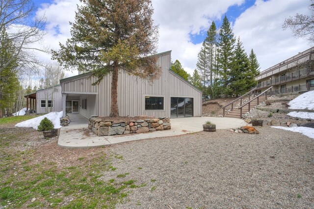 9359 State Highway 9 Unit G5, Breckenridge, CO 80424 - back of house with a garage, driveway, and board and batten siding