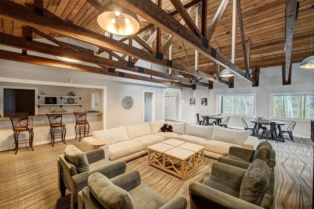 9359 State Highway 9 Unit G5, Breckenridge, CO 80424 - carpeted living area featuring wood ceiling with exposed beams, baseboards, and high vaulted ceiling