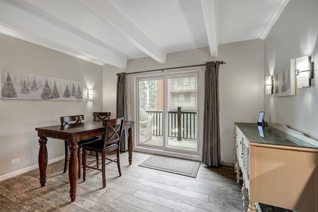 9359 State Highway 9 Unit G5, Breckenridge, CO 80424 - dining space with light wood-type flooring, beamed ceiling, and baseboards