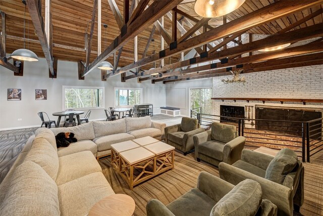 9359 State Highway 9 Unit G5, Breckenridge, CO 80424 - living area featuring high vaulted ceiling, baseboards, plenty of natural light, and wooden ceiling with exposed beams