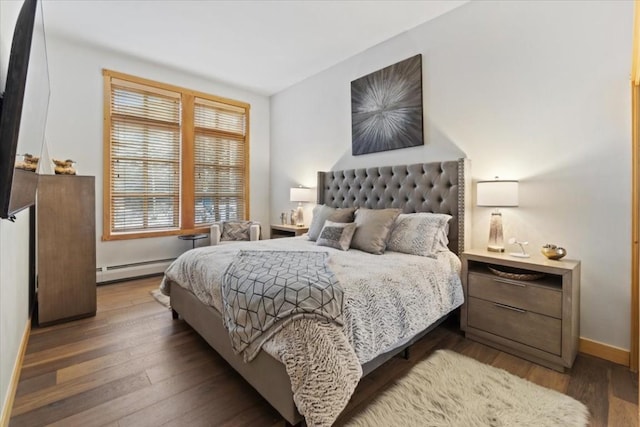 910 Copper Rd Unit 105, Frisco, CO 80443 - bedroom with wood finished floors, baseboards, and a baseboard radiator