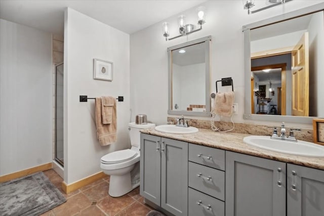910 Copper Rd Unit 105, Frisco, CO 80443 - full bathroom with a shower stall, toilet, double vanity, baseboards, and tile patterned flooring