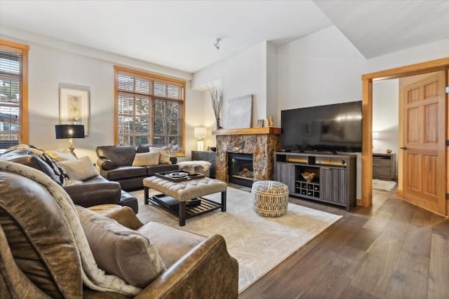 910 Copper Rd Unit 105, Frisco, CO 80443 - living area featuring wood finished floors, plenty of natural light, and a fireplace