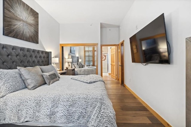 910 Copper Rd Unit 105, Frisco, CO 80443 - bedroom with wood finished floors, baseboards, and lofted ceiling