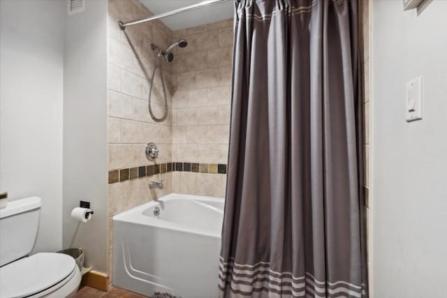 910 Copper Rd Unit 105, Frisco, CO 80443 - bathroom featuring toilet, shower / bathtub combination with curtain, and baseboards