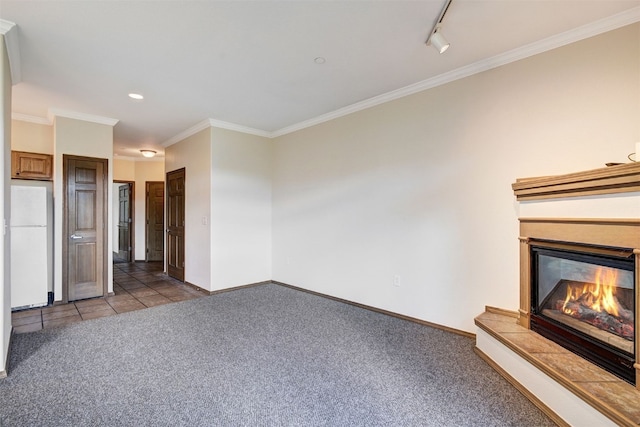 951 N Ten Mile Dr Unit C15, Frisco, CO 80443 - unfurnished living room with light colored carpet, ornamental molding, a glass covered fireplace, track lighting, and recessed lighting