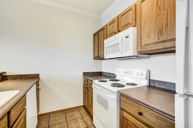 951 N Ten Mile Dr Unit C15, Frisco, CO 80443 - kitchen with white appliances, crown molding, dark countertops, and brown cabinets