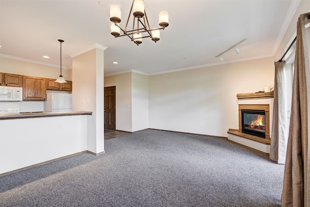 951 N Ten Mile Dr Unit C15, Frisco, CO 80443 - unfurnished living room with carpet flooring, a glass covered fireplace, crown molding, recessed lighting, and a chandelier