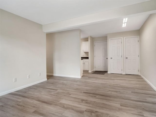 1565 Shadow Run Frontage Unit 104, Steamboat Springs, CO 80487 - spare room with baseboards and light wood finished floors