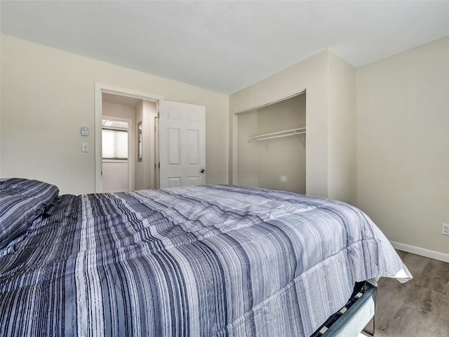 1565 Shadow Run Frontage Unit 104, Steamboat Springs, CO 80487 - bedroom featuring wood finished floors, baseboards, and a closet