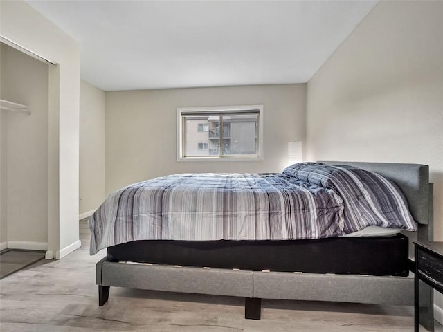 1565 Shadow Run Frontage Unit 104, Steamboat Springs, CO 80487 - bedroom with baseboards and wood finished floors