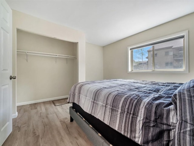 1565 Shadow Run Frontage Unit 104, Steamboat Springs, CO 80487 - bedroom featuring wood finished floors, a closet, and baseboards