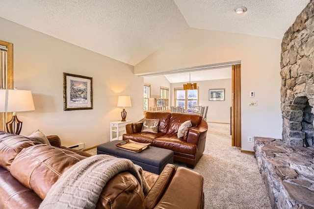 1116 Baldy Rd Unit 1116, Breckenridge, CO 80424 - carpeted living area featuring vaulted ceiling, a textured ceiling, a baseboard radiator, and a chandelier