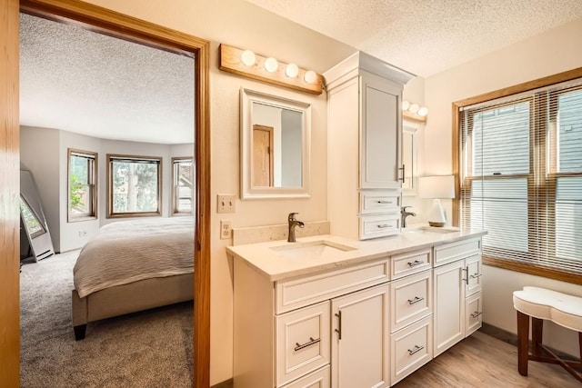 1116 Baldy Rd Unit 1116, Breckenridge, CO 80424 - full bathroom with a textured ceiling, double vanity, and connected bathroom