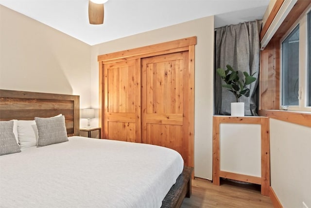 bedroom with wood finished floors and a ceiling fan