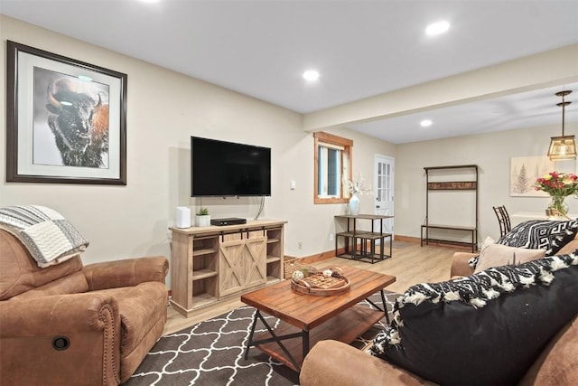 living area featuring recessed lighting, light wood-type flooring, and baseboards