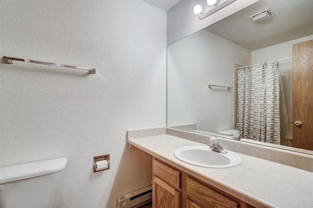 300 Primrose Path Unit 37, Breckenridge, CO 80424 - bathroom with a baseboard heating unit, vanity, a textured wall, and curtained shower
