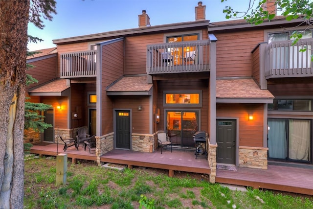 300 Primrose Path Unit 37, Breckenridge, CO 80424 - back of property featuring a balcony, stone siding, and a chimney