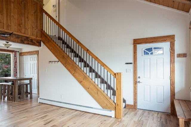 602 Ryan Gulch Rd Unit B, Silverthorne, CO 80498 - entryway featuring baseboard heating, stairs, wood finished floors, and a high ceiling