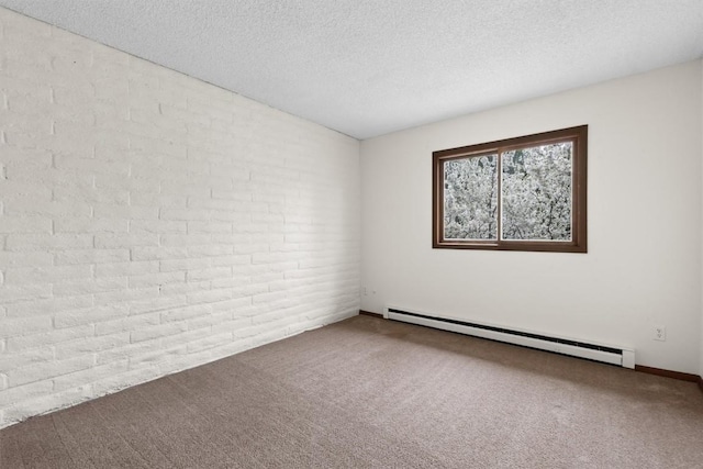 18 Balsam Ct Unit 0, Steamboat Springs, CO 80487 - carpeted empty room featuring a baseboard radiator, a textured ceiling, and brick wall