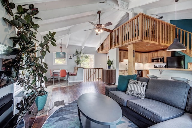 73 Illinois Gulch Rd Unit 8, Breckenridge, CO 80424 - living room with wood finished floors, beam ceiling, a ceiling fan, and high vaulted ceiling