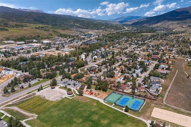 birds eye view of property with a mountain view