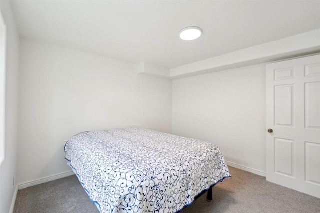 carpeted bedroom with baseboards