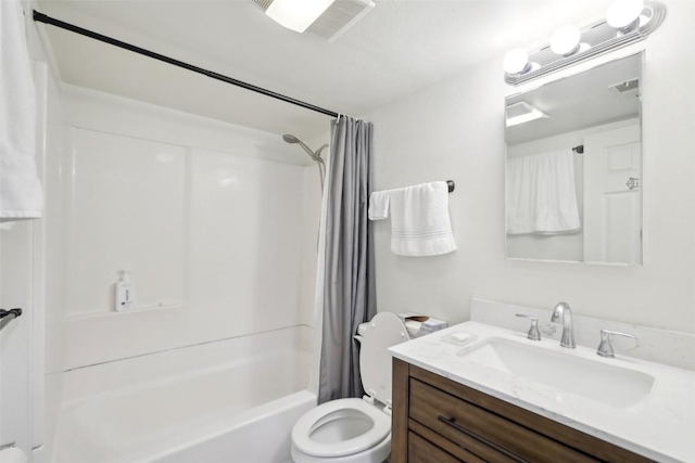 bathroom featuring visible vents, shower / bath combo with shower curtain, vanity, and toilet