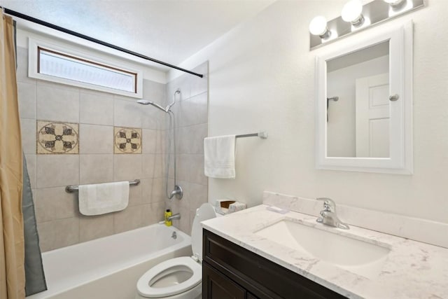 full bathroom with shower / bath combo, vanity, and toilet