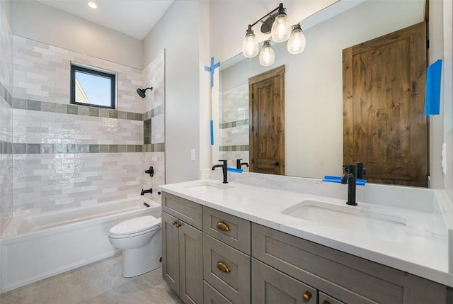 bathroom with shower / washtub combination, a sink, double vanity, and toilet