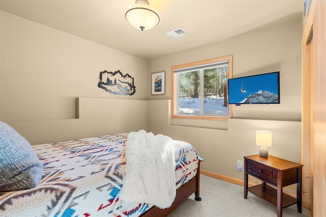 bedroom featuring visible vents and baseboards