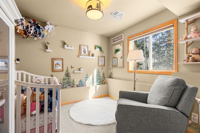 bedroom with visible vents and baseboards