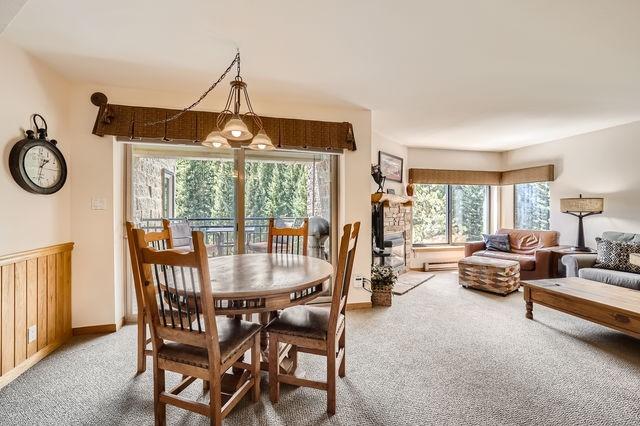 755 Columbine Rd Unit 303, Breckenridge, CO 80424 - carpeted dining area featuring baseboards and a baseboard radiator