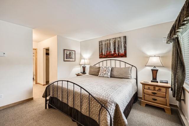 755 Columbine Rd Unit 303, Breckenridge, CO 80424 - bedroom with carpet, baseboards, a fireplace, and a walk in closet