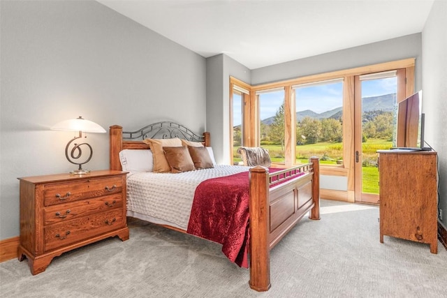 bedroom featuring light colored carpet