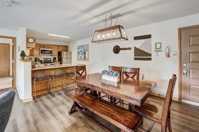 23034 US Highway 6 Unit 203, Dillon, CO 80435 - dining room featuring light wood-type flooring