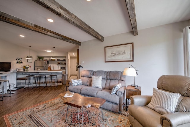 2442 Ryan Gulch Ct Unit 204, Silverthorne, CO 80498 - living area featuring wood finished floors, beamed ceiling, and recessed lighting