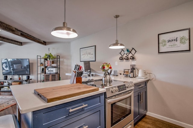 2442 Ryan Gulch Ct Unit 204, Silverthorne, CO 80498 - kitchen featuring stainless steel range with electric stovetop, dark wood-style floors, light countertops, and baseboards