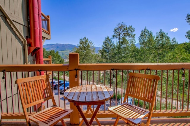 2442 Ryan Gulch Ct Unit 204, Silverthorne, CO 80498 - wooden terrace featuring a mountain view and outdoor dining space
