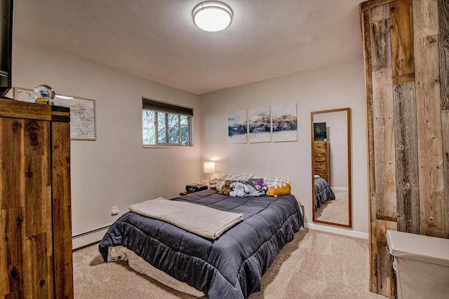 2442 Ryan Gulch Ct Unit 204, Silverthorne, CO 80498 - bedroom featuring carpet flooring, a baseboard radiator, and baseboards