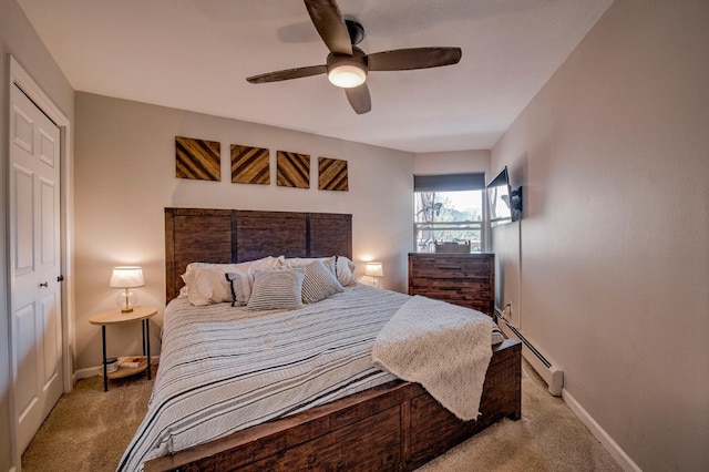2442 Ryan Gulch Ct Unit 204, Silverthorne, CO 80498 - carpeted bedroom with baseboard heating, baseboards, and a ceiling fan