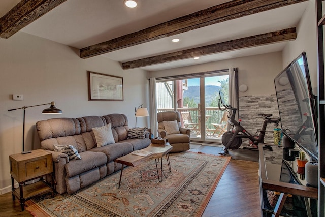 2442 Ryan Gulch Ct Unit 204, Silverthorne, CO 80498 - living area with wood finished floors, beam ceiling, and recessed lighting