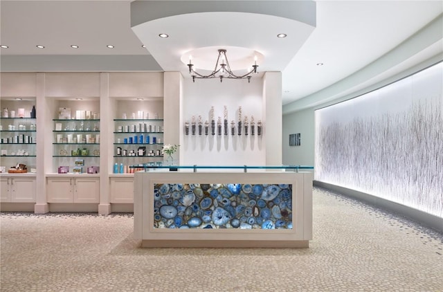reception area with a notable chandelier