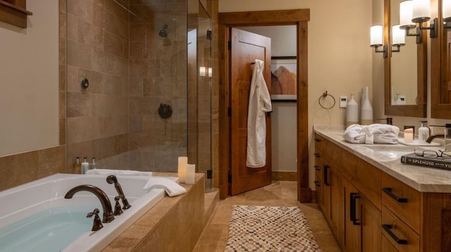 full bathroom featuring a shower stall, a garden tub, and vanity
