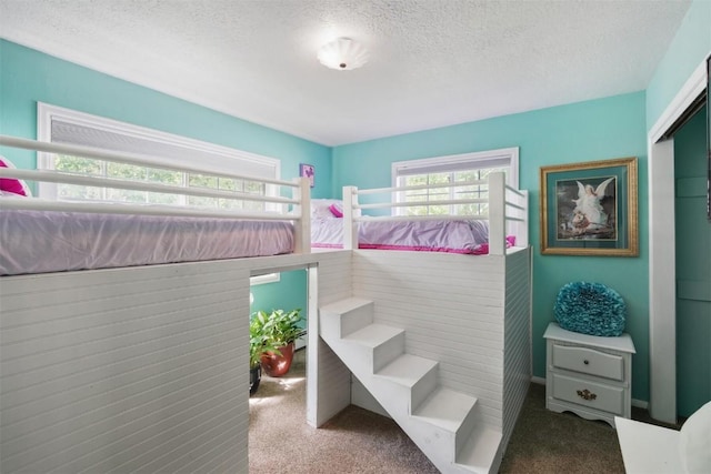 897 Deer Path Rd, Dillon, CO 80435 - carpeted bedroom featuring a textured ceiling