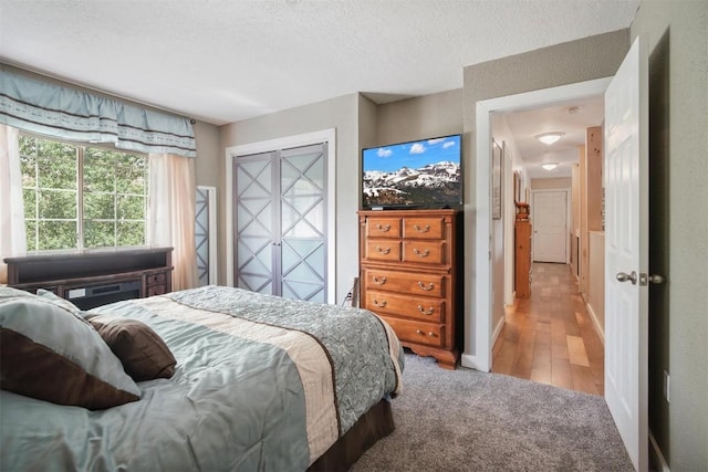 897 Deer Path Rd, Dillon, CO 80435 - bedroom featuring a textured ceiling and light colored carpet