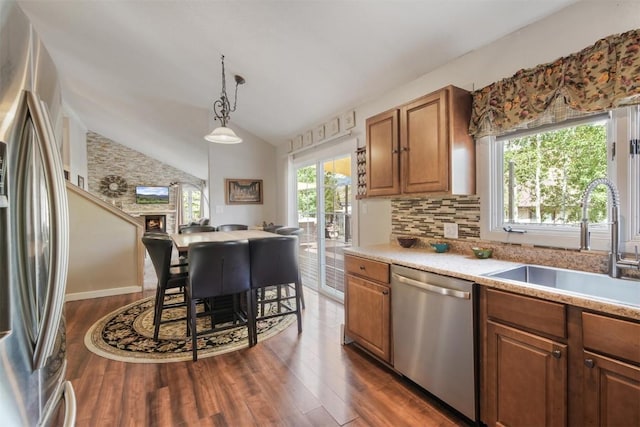 897 Deer Path Rd, Dillon, CO 80435 - kitchen with appliances with stainless steel finishes, a sink, dark wood-style flooring, light countertops, and brown cabinetry